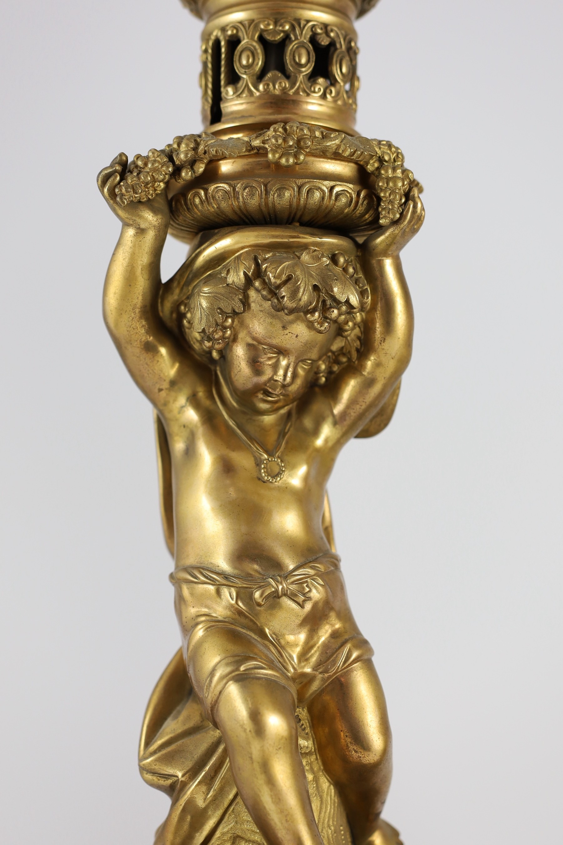 A pair of Victorian style ormolu table lamps, 50cm high to fittings